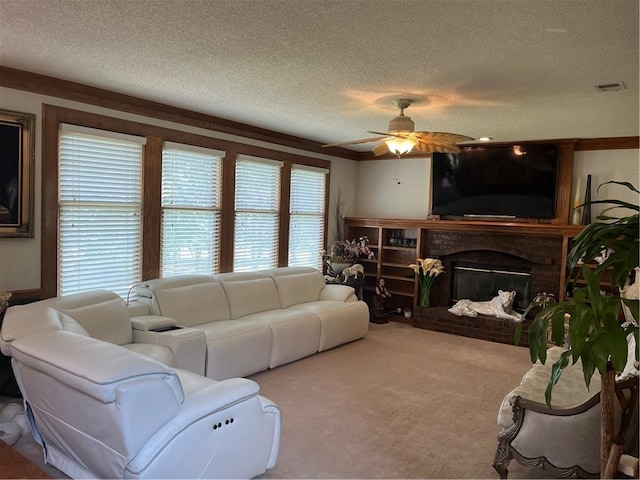 505 Williamsburg Dr, Lees Summit, MO 64063 - living room with a textured ceiling, a fireplace, a ceiling fan, and carpet