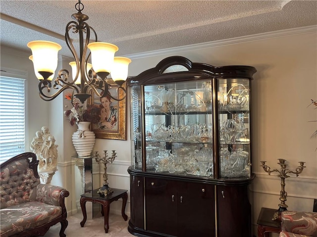 505 Williamsburg Dr, Lees Summit, MO 64063 - living area featuring a textured ceiling, a chandelier, and crown molding