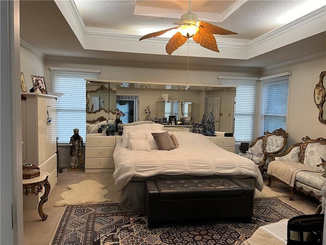 505 Williamsburg Dr, Lees Summit, MO 64063 - bedroom with a raised ceiling, crown molding, and a ceiling fan