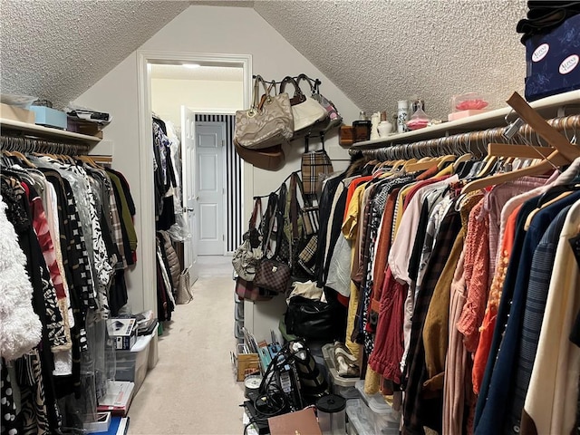 505 Williamsburg Dr, Lees Summit, MO 64063 - spacious closet featuring carpet flooring and lofted ceiling
