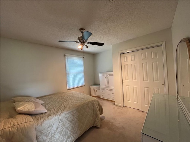 505 Williamsburg Dr, Lees Summit, MO 64063 - bedroom with light carpet, a closet, a ceiling fan, and a textured ceiling