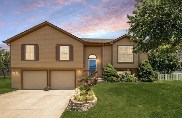 1903 NW Rosewood Dr, Grain Valley, MO 64029 - raised ranch featuring an attached garage and concrete driveway