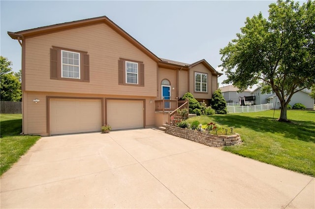 1903 NW Rosewood Dr, Grain Valley, MO 64029 - split foyer home with a garage and concrete driveway