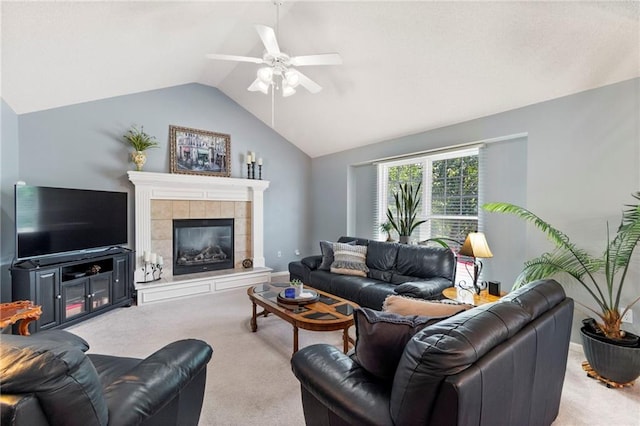 1903 NW Rosewood Dr, Grain Valley, MO 64029 - living room with carpet, vaulted ceiling, a ceiling fan, and a tiled fireplace