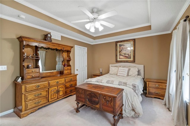 1903 NW Rosewood Dr, Grain Valley, MO 64029 - bedroom featuring light carpet, ornamental molding, a tray ceiling, and a ceiling fan