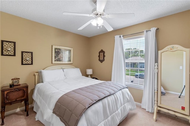 1903 NW Rosewood Dr, Grain Valley, MO 64029 - bedroom with light colored carpet, a textured ceiling, and ceiling fan