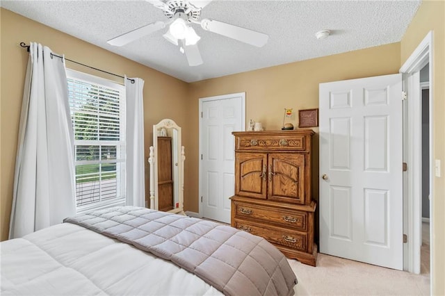 1903 NW Rosewood Dr, Grain Valley, MO 64029 - bedroom with light colored carpet, a textured ceiling, and ceiling fan