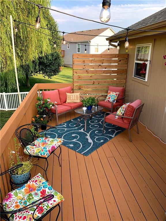 1903 NW Rosewood Dr, Grain Valley, MO 64029 - deck featuring outdoor lounge area
