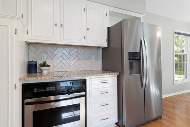 5501 W 86th St, Overland Park, KS 66207 - kitchen featuring stainless steel appliances, white cabinetry, and backsplash