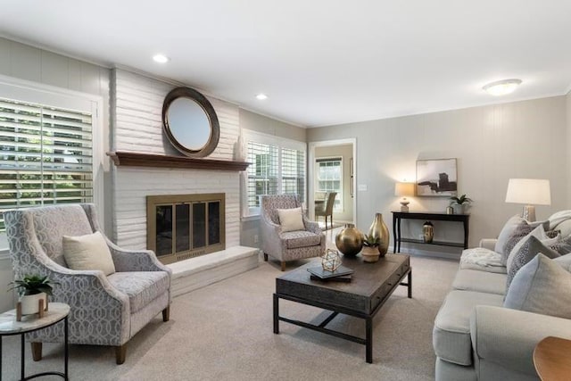 5501 W 86th St, Overland Park, KS 66207 - living room with a brick fireplace, carpet floors, and crown molding