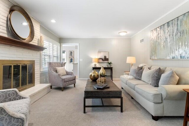5501 W 86th St, Overland Park, KS 66207 - living room featuring crown molding, carpet flooring, and a fireplace