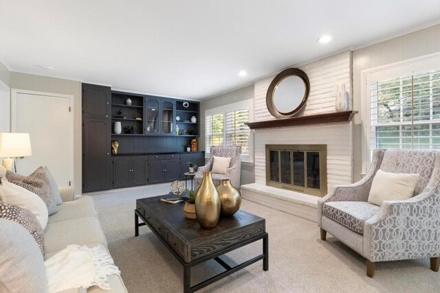 5501 W 86th St, Overland Park, KS 66207 - living room with light colored carpet, a fireplace, and recessed lighting