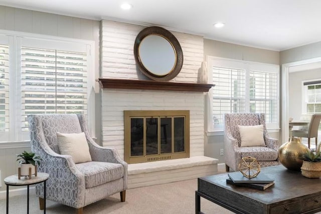 5501 W 86th St, Overland Park, KS 66207 - carpeted living room with a brick fireplace, recessed lighting, and crown molding
