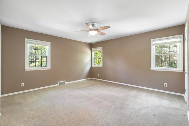 5501 W 86th St, Overland Park, KS 66207 - carpeted spare room featuring a ceiling fan and baseboards