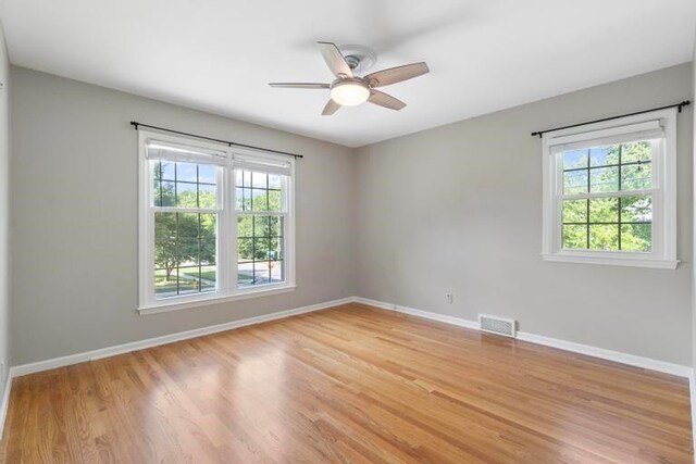 5501 W 86th St, Overland Park, KS 66207 - unfurnished room featuring a ceiling fan and light wood-style flooring