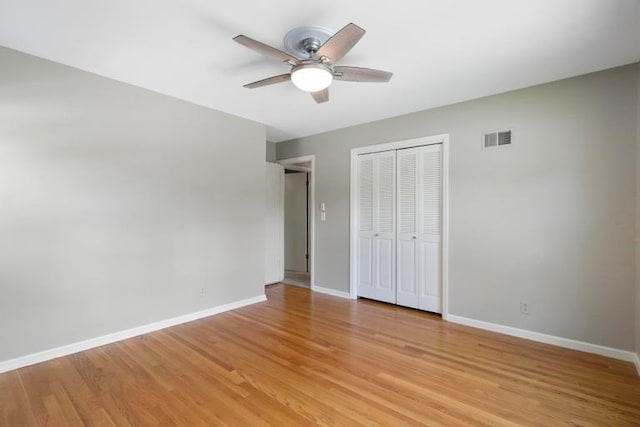 5501 W 86th St, Overland Park, KS 66207 - unfurnished bedroom with a closet, light wood finished floors, and a ceiling fan