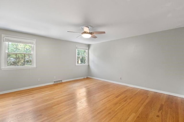 5501 W 86th St, Overland Park, KS 66207 - spare room with ceiling fan and light wood-style flooring