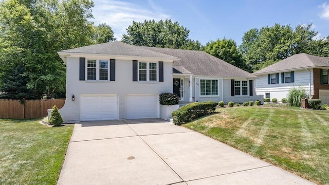 5501 W 86th St, Overland Park, KS 66207 - split level home with concrete driveway and an attached garage