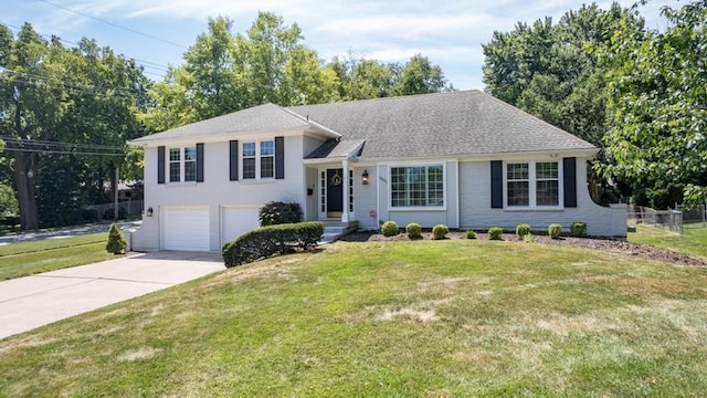 5501 W 86th St, Overland Park, KS 66207 - tri-level home with an attached garage and concrete driveway