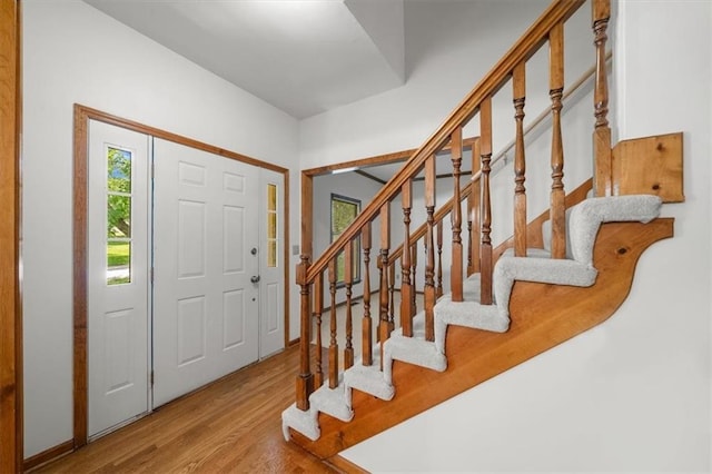 13217 S Locust St, Olathe, KS 66062 - foyer entrance featuring wood finished floors and stairway
