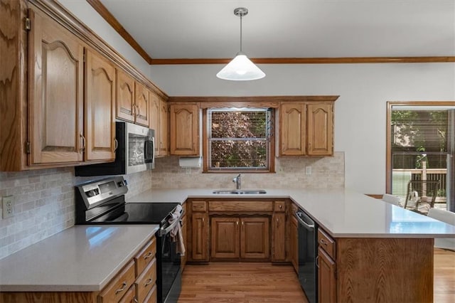 13217 S Locust St, Olathe, KS 66062 - kitchen with stainless steel appliances, a peninsula, ornamental molding, light wood finished floors, and light countertops