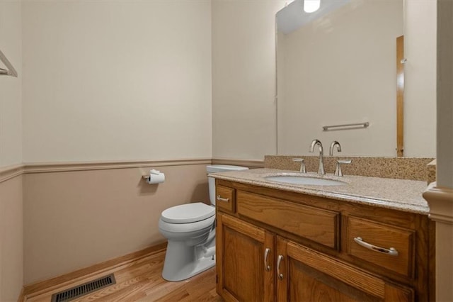 13217 S Locust St, Olathe, KS 66062 - bathroom with vanity and wood finished floors