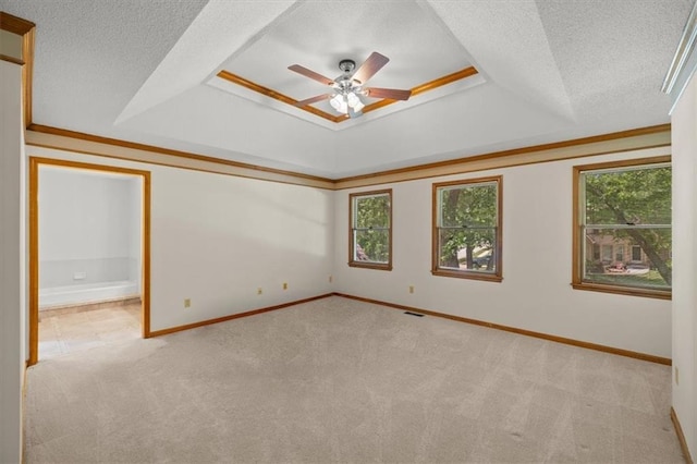 13217 S Locust St, Olathe, KS 66062 - carpeted empty room featuring a raised ceiling, ceiling fan, a textured ceiling, and crown molding