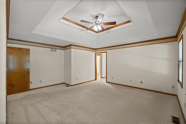 13217 S Locust St, Olathe, KS 66062 - spare room with a raised ceiling, carpet flooring, ceiling fan, and ornamental molding