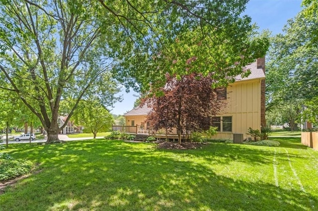 13217 S Locust St, Olathe, KS 66062 - view of grassy yard featuring a deck