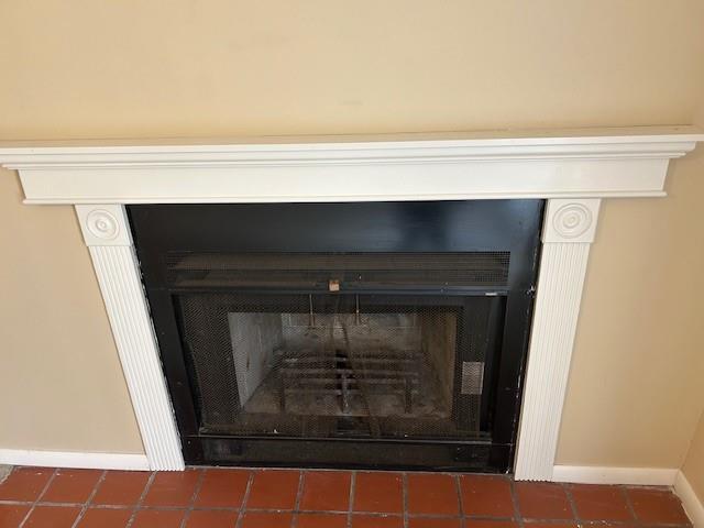 3600 Gabriel Ave Unit 303, Parsons, KS 67357 - detailed view of a fireplace and baseboards