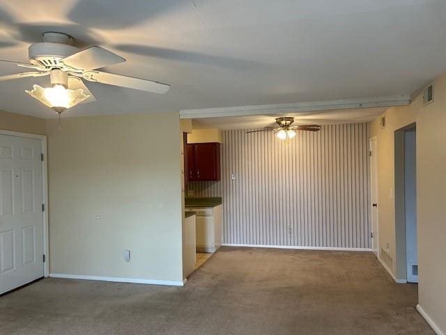3600 Gabriel Ave Unit 303, Parsons, KS 67357 - unfurnished living room featuring a ceiling fan and carpet