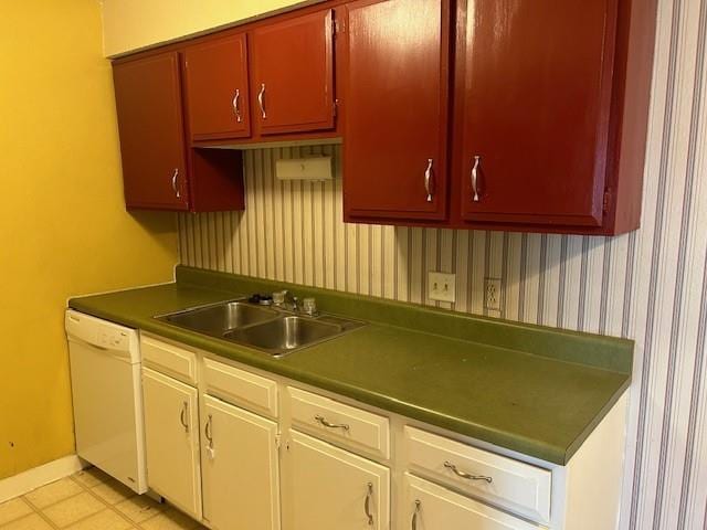 3600 Gabriel Ave Unit 303, Parsons, KS 67357 - kitchen with white dishwasher, dark countertops, and wallpapered walls