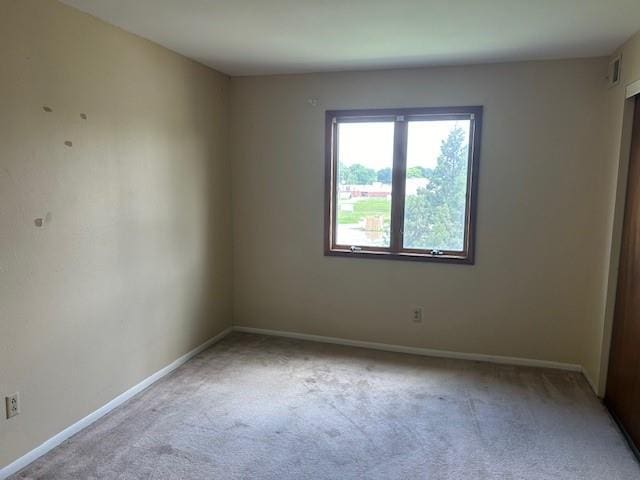 3600 Gabriel Ave Unit 303, Parsons, KS 67357 - spare room with carpet flooring and baseboards