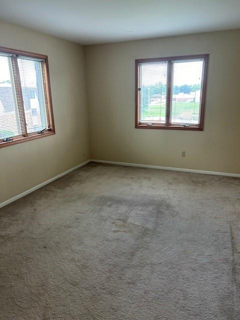 3600 Gabriel Ave Unit 303, Parsons, KS 67357 - carpeted empty room featuring baseboards