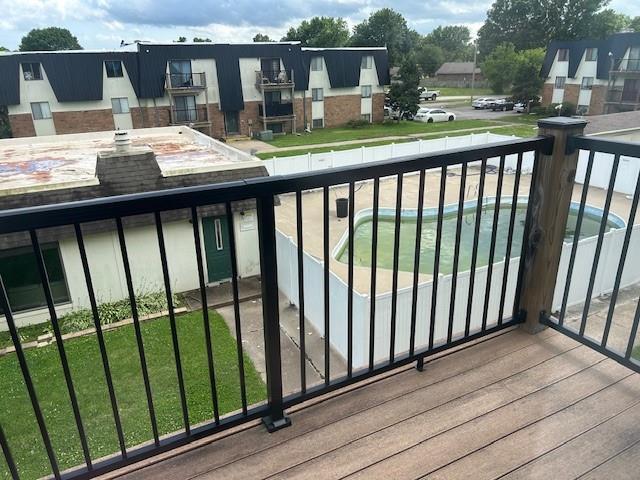 3600 Gabriel Ave Unit 303, Parsons, KS 67357 - balcony featuring view of pool area