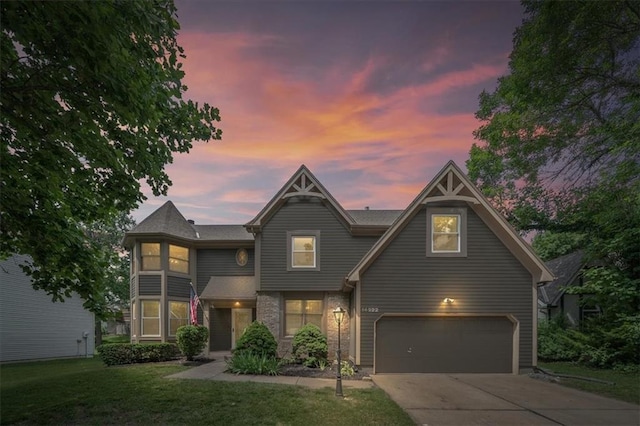 14522 W 61st St, Shawnee, KS 66216 - victorian home with an attached garage, a lawn, and driveway