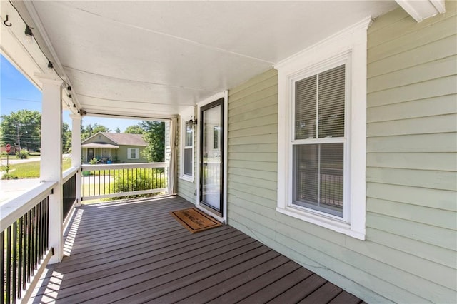 217 W 9th St, Ottawa, KS 66067 - view of wooden porch