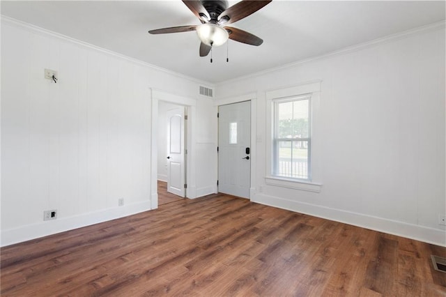 217 W 9th St, Ottawa, KS 66067 - empty room featuring a ceiling fan, crown molding, and wood finished floors