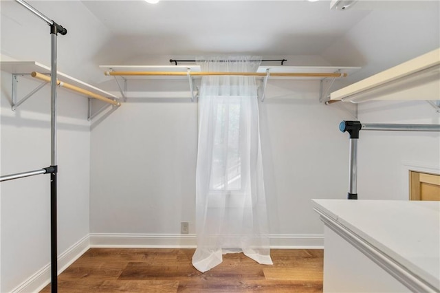 217 W 9th St, Ottawa, KS 66067 - walk in closet featuring wood finished floors