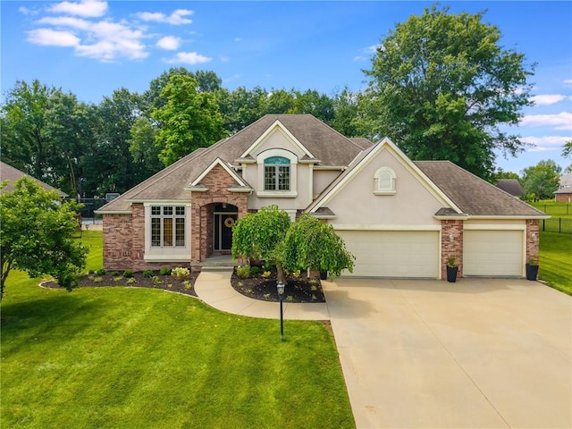 4902 Corinth Dr, Saint Joseph, MO 64506 - traditional-style home featuring stucco siding, a front lawn, concrete driveway, roof with shingles, and a garage