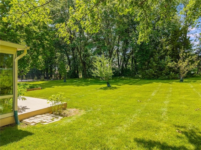4902 Corinth Dr, Saint Joseph, MO 64506 - view of grassy yard with a deck