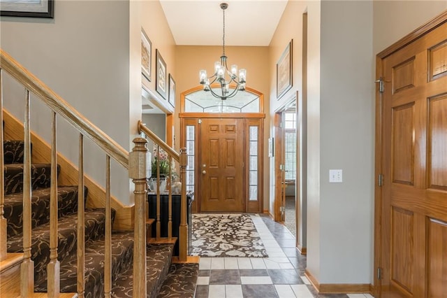 4902 Corinth Dr, Saint Joseph, MO 64506 - tiled entryway featuring a chandelier, a towering ceiling, and stairs