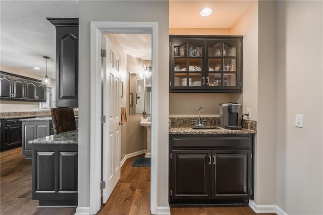 4902 Corinth Dr, Saint Joseph, MO 64506 - indoor wet bar with dark wood-type flooring and recessed lighting