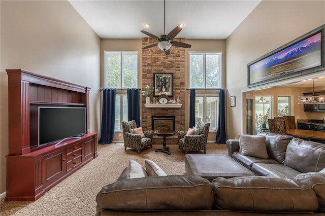 4902 Corinth Dr, Saint Joseph, MO 64506 - living area featuring carpet floors, a brick fireplace, healthy amount of natural light, and a high ceiling