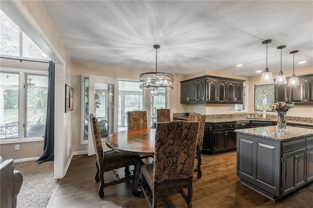 4902 Corinth Dr, Saint Joseph, MO 64506 - dining space with plenty of natural light, dark wood-style flooring, a chandelier, recessed lighting, and a textured ceiling