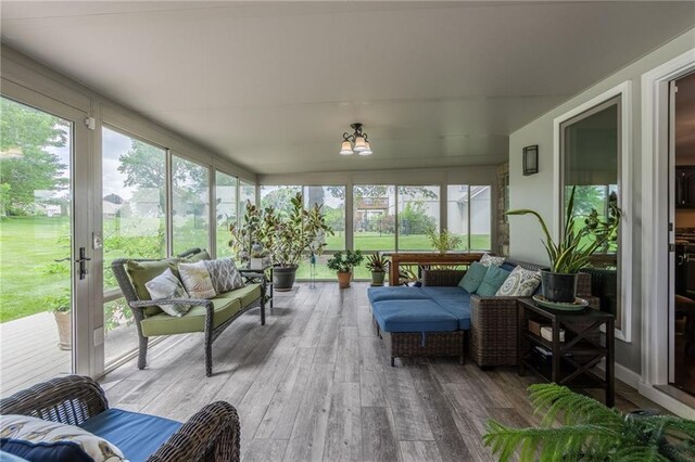 4902 Corinth Dr, Saint Joseph, MO 64506 - sunroom featuring hardwood / wood-style floors, an outdoor hangout area, and a wooden deck