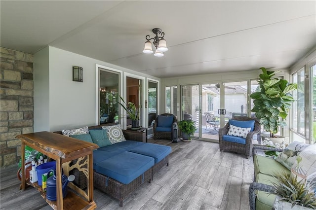 4902 Corinth Dr, Saint Joseph, MO 64506 - sunroom / solarium with hardwood / wood-style floors, a chandelier, and an outdoor living space