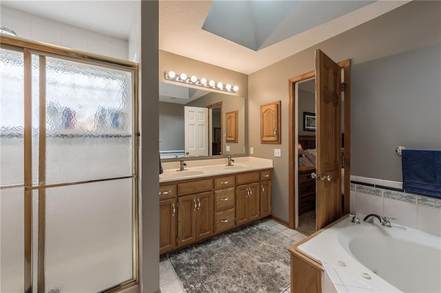 4902 Corinth Dr, Saint Joseph, MO 64506 - bathroom with double vanity, a bath, tile patterned flooring, connected bathroom, and a stall shower