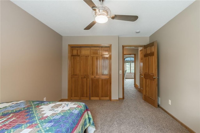4902 Corinth Dr, Saint Joseph, MO 64506 - bedroom featuring light carpet, a closet, and a ceiling fan