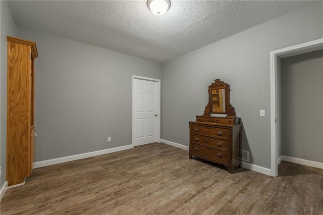 4902 Corinth Dr, Saint Joseph, MO 64506 - bedroom with wood finished floors and a textured ceiling